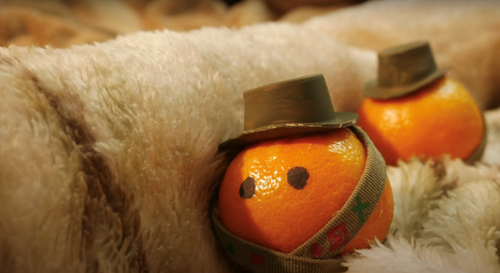 Peelings End: Still of two oranges dressed in military costumes